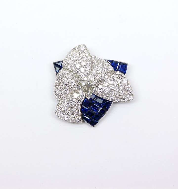 Late Art Deco diamond and sapphire stylised flower brooch